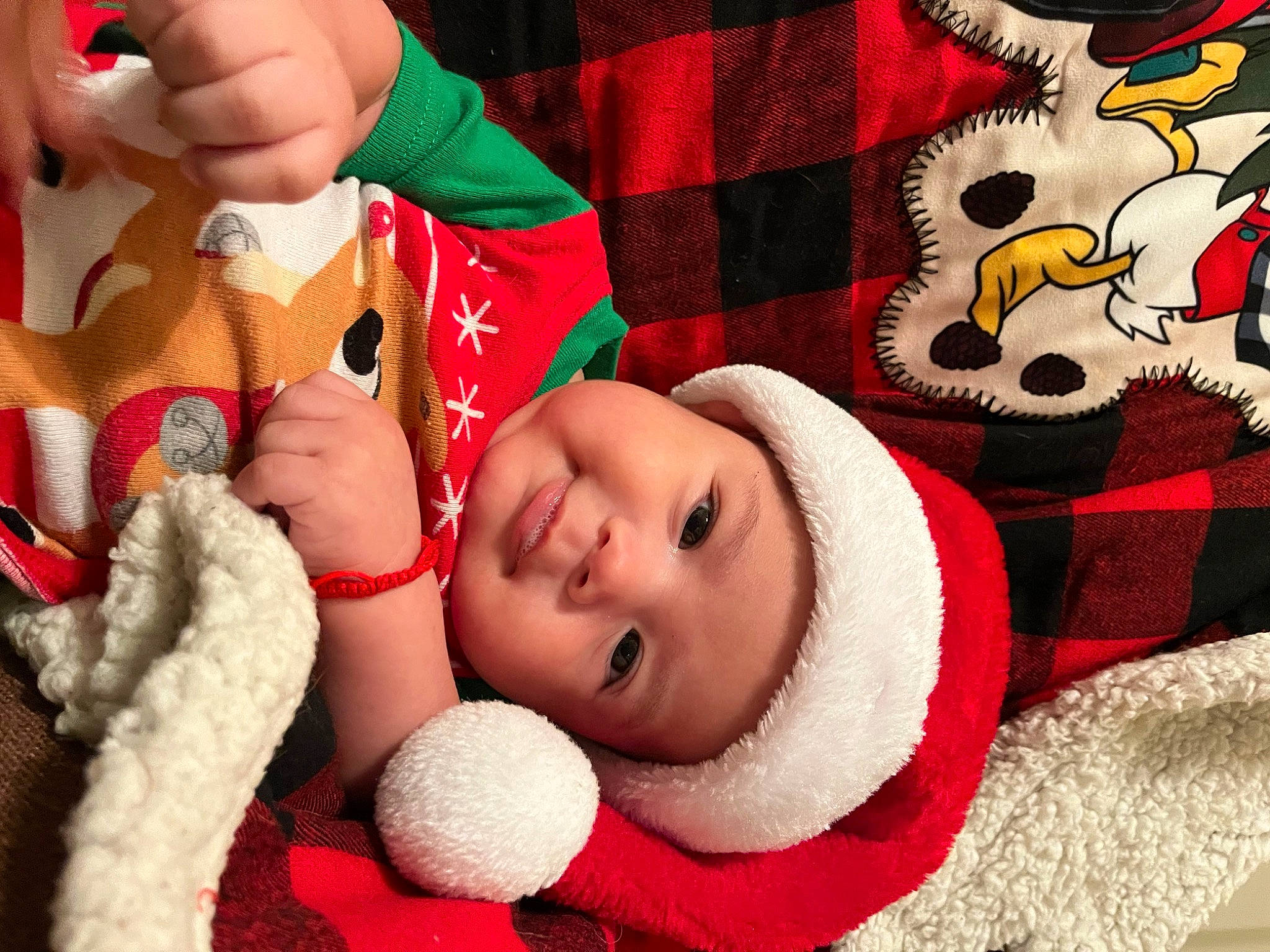 Jose joined the competition — help win amazing prizes! baby, baby_toddler_clothing, beauty, cap, cheek, eye, fun, happy, head, headwear, lip, mouth, nose, person, photograph, red, santa_claus, skin, smile, textile