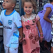 Nour participe au concours pour gagner de l'argent avec cette photo : accessories, adult, boy, bracelet, child, clothing, dress, eveningdress, face, female, footwear, formalwear, girl, jewelry, male, person, sandal, shoe, shorts, woman