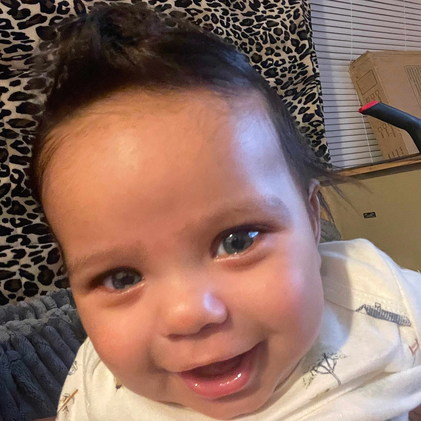 Zion joined the competition — help win amazing prizes! baby, background, blanket, child, close_up, clothing, cozy, cute, expression, face, happy, head, indoor, infant, leopard_print, person, portrait, smiling, warm, young