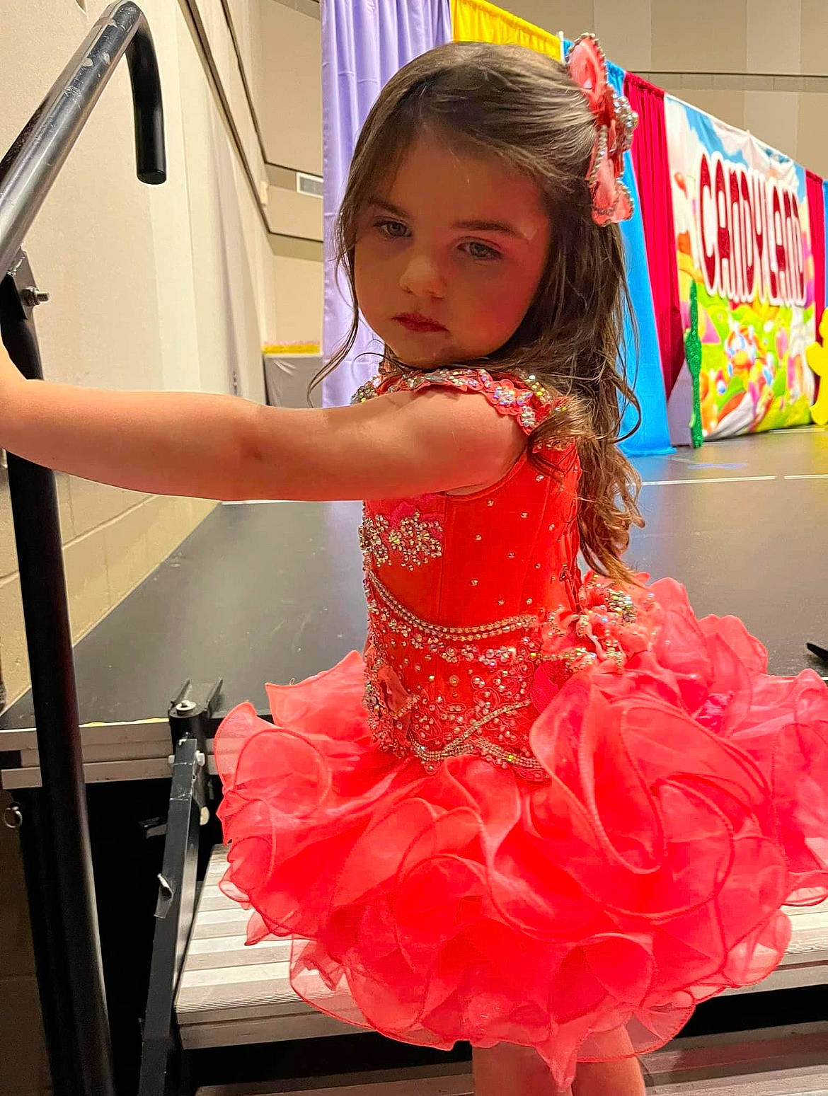 Jerzie is registered to the contest to win money with this photo: child, dance, dress, entertainment, event, fashion_design, flooring, formal_wear, fun, happy, magenta, performance_art, performing_arts, person, pink, ruffle, thigh, toddler, vehicle_door, waist