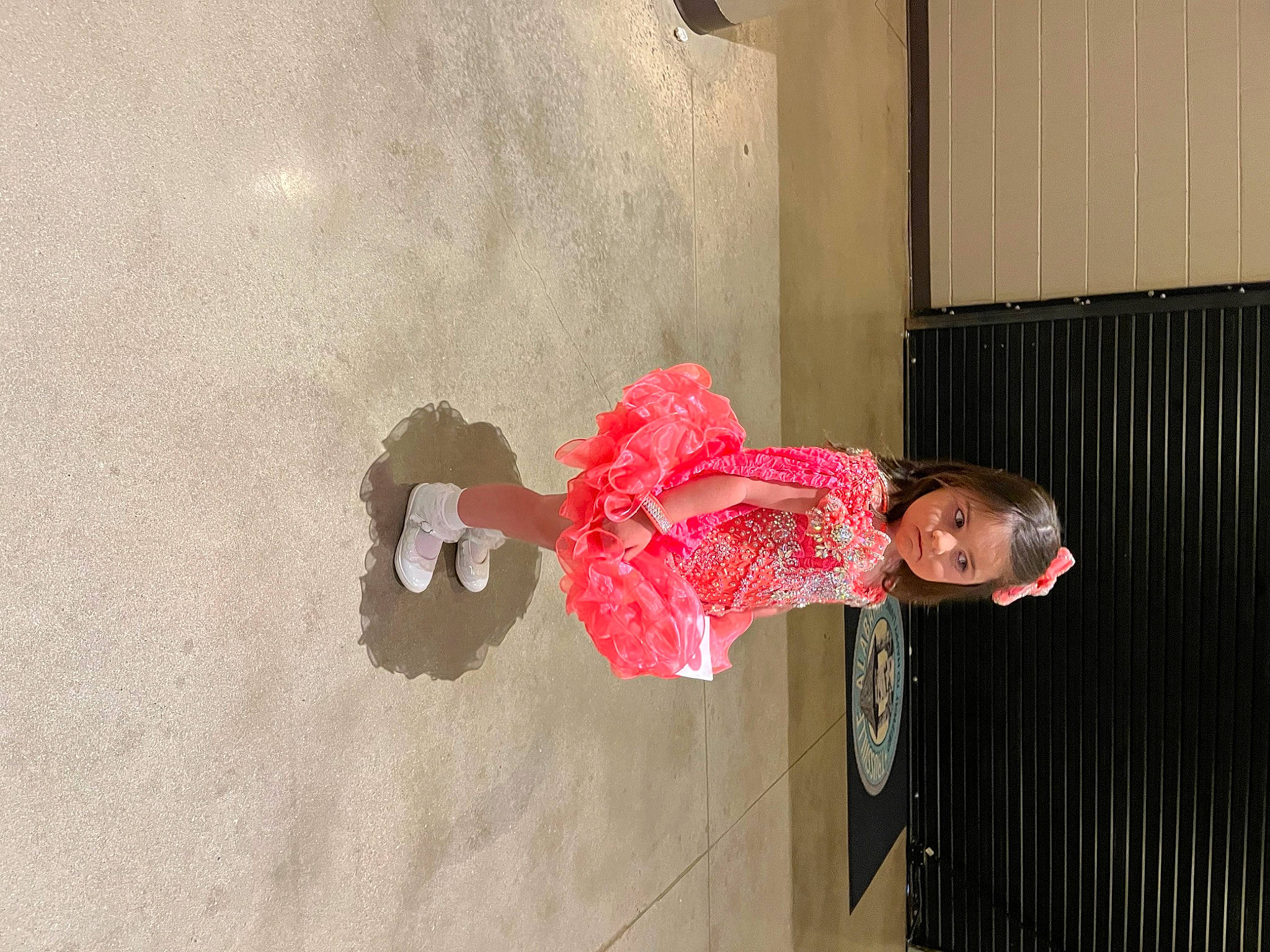 Jerzie is registered to the contest to win money with this photo: art, carmine, child, concrete, dress, fashion_design, flooring, magenta, person, plaster, room, visual_arts, window, wood