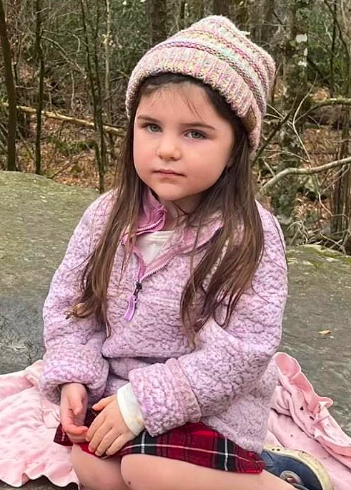 Jerzie joined the competition — help win amazing prizes! brown_hair, cap, child, grass, hairstyle, happy, headwear, jewellery, lip, long_hair, outerwear, pattern, people_in_nature, person, pink, plaid, plant, sitting, sleeve, tartan