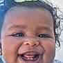Stella Aïcha a rejoint le concours — aidez-le/la à gagner de superbes lots ! baby, child, close_up, clothing, curly_hair, cute, expression, face, flower, happy, headband, infant, joyful, outdoor, person, portrait, skin, smiling, teeth, young