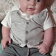 Leyland joined the competition — help win amazing prizes! baby, child, infant, clothing, vest, pants, toy, colorful_toy, egg_shaped_toy, cushion, floral_pattern, indoor, portrait, sitting, smiling, cute, person, face, hand, foot