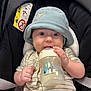 Léo participe au concours pour gagner de l'argent avec cette photo : baby, blue_hat, bottle, car_seat, child, clothing, comfort, cute, expression, eyes, face, feeding, hand, hat, indoors, infant, milk, person, sitting, striped