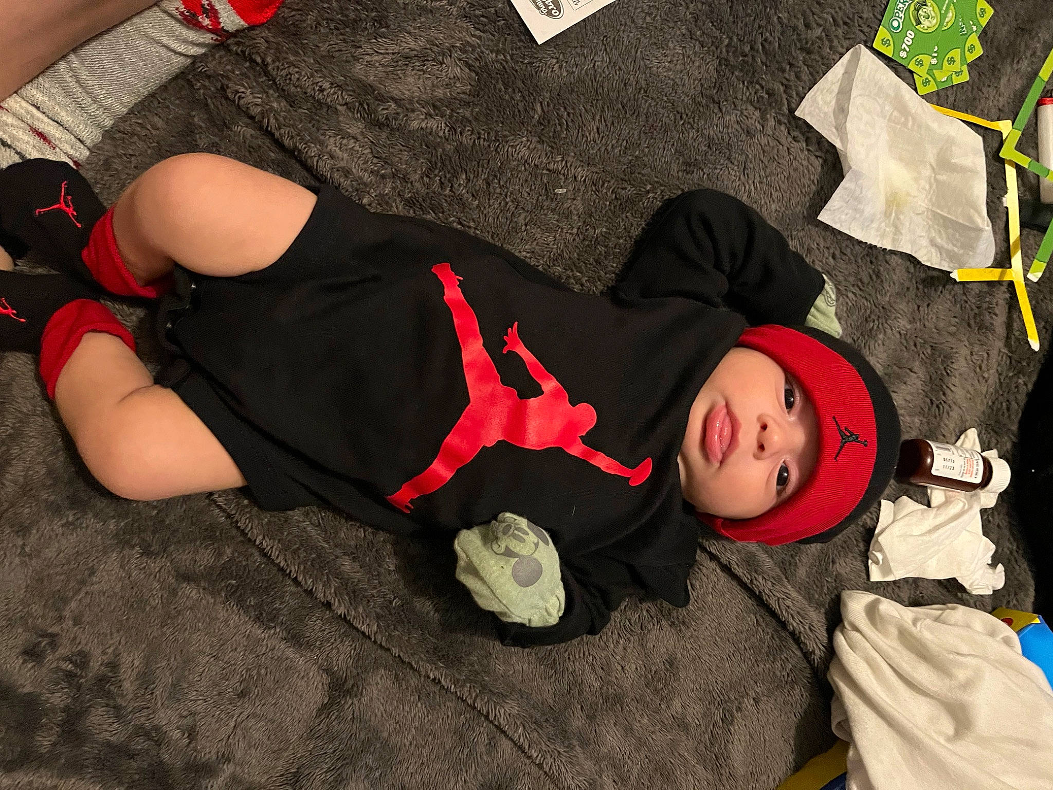 Auden Zubia joined the competition — help win amazing prizes! baby, baby_toddler_clothing, carmine, comfort, costume, event, fictional_character, foot, fun, grass, hat, headwear, human_body, human_leg, knee, lap, pattern, person, sitting, sock