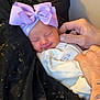 baby, newborn, bow, lavender, sleeping, smile, hands, tattoo, ring, blanket, clothing, person, infant, cute, soft, portrait, resting, closeup, cozy, indoor