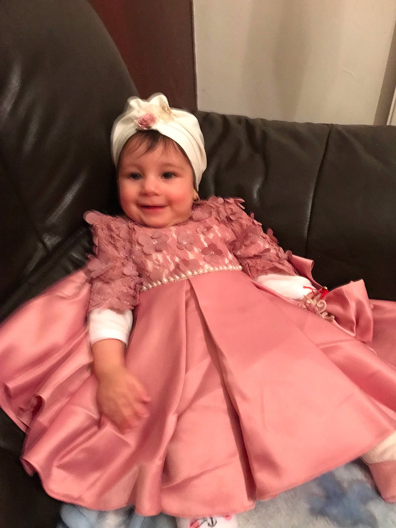 Erika is registered to the contest to win money with this photo: baby, child, clothing, costume, dress, joy, outerwear, peach, person, pink, skin, textile, toddler