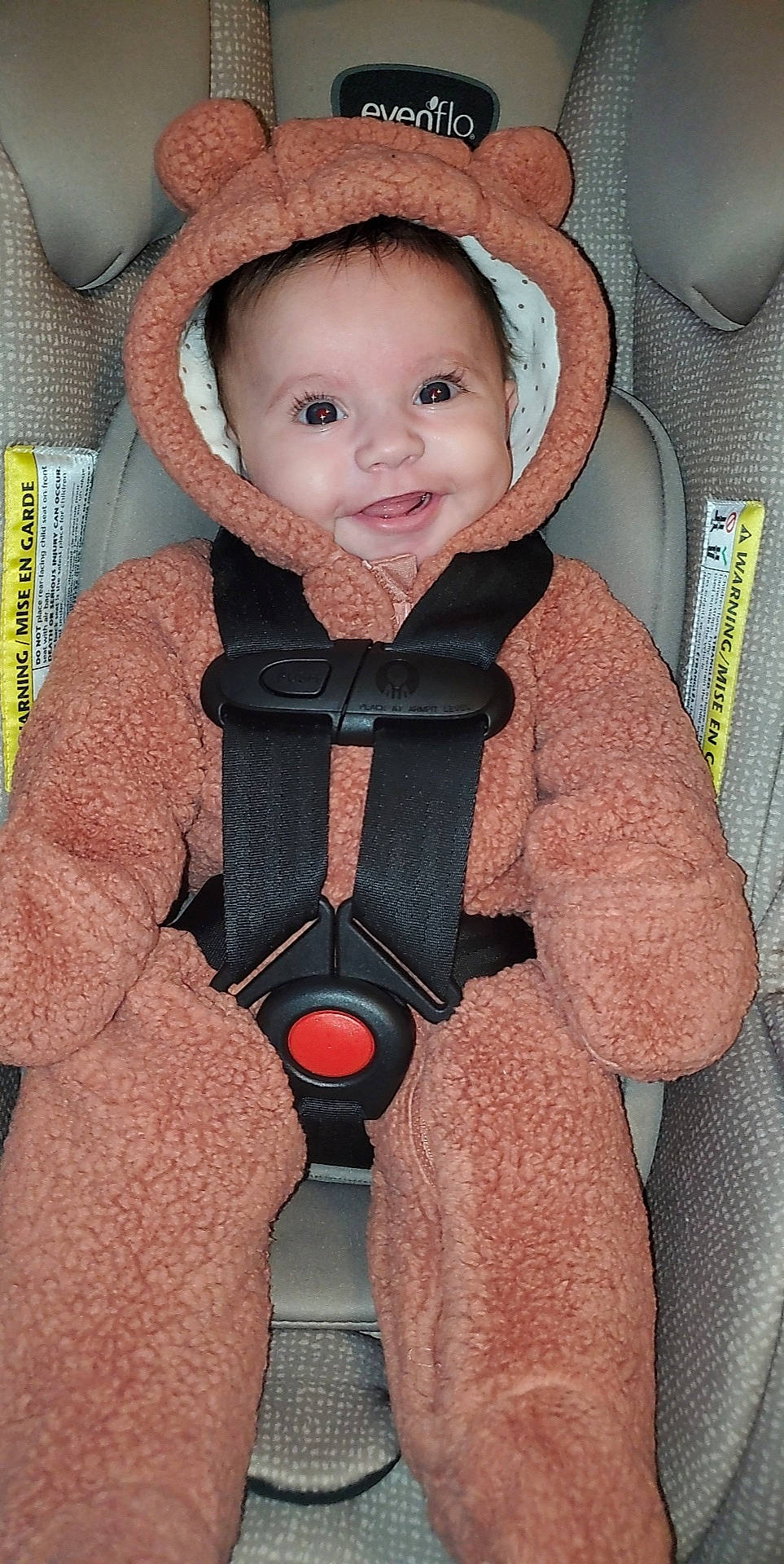 Hazel joined the competition — help win amazing prizes! baby, baby_carriage, baby_products, baby_safety, baby_toddler_clothing, car_seat, cheek, child, comfort, eye, head, jacket, outerwear, person, seat_belt, skin, sleeve, smile, toddler, vest