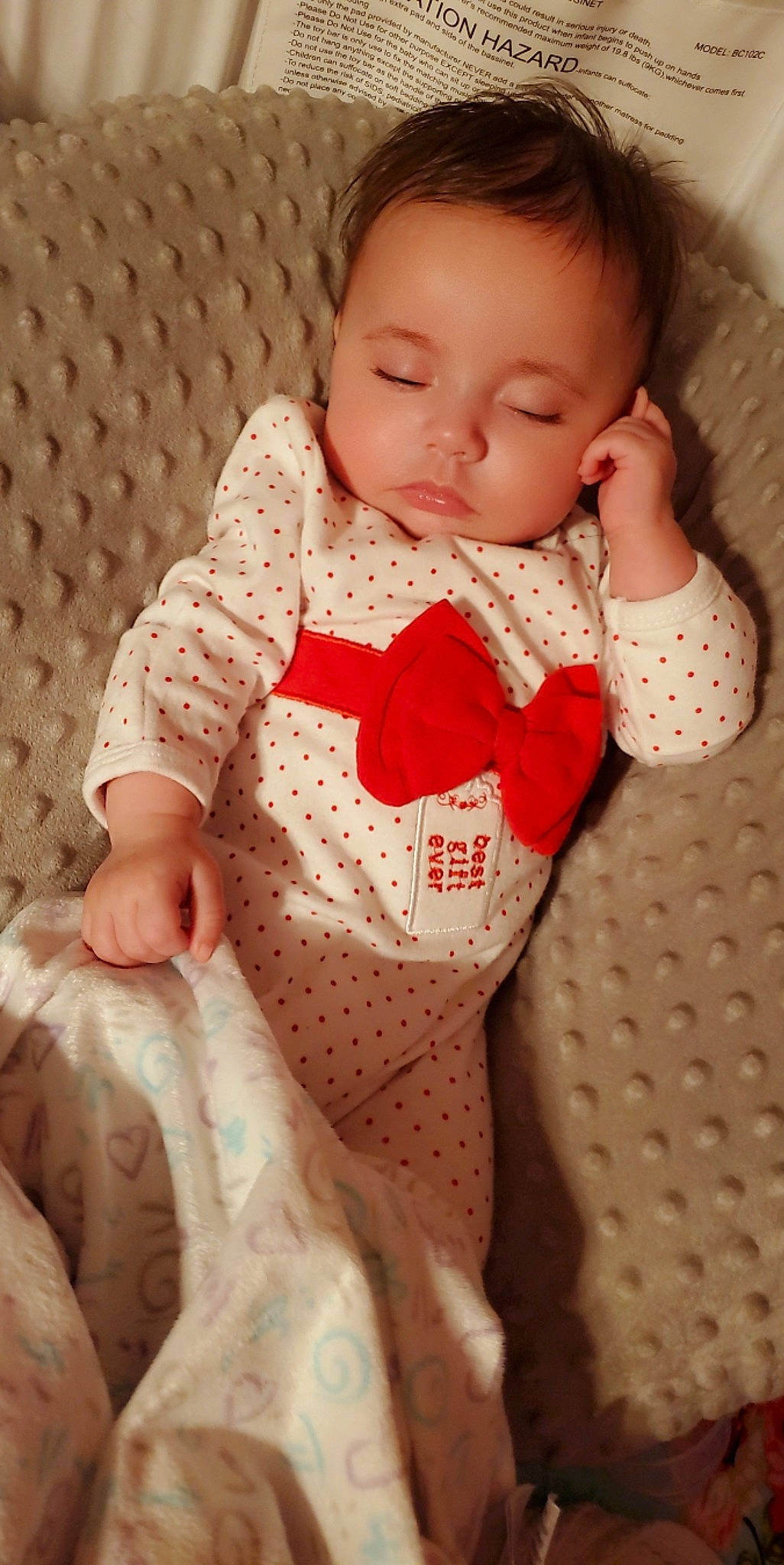 Hazel is registered to the contest to win money with this photo: baby, baby_toddler_clothing, cheek, child, collar, comfort, doll, dress, dress_shirt, face, hand, head, linens, neck, pattern, person, pink, skin, sleeve, textile