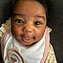 Kaeliah joined the competition — help win amazing prizes! baby, infant, face, eyes, tongue, bib, clothing, cute, smile, closeup, child, person, portrait, adorable, skin, hair, fabric, love, expression, young