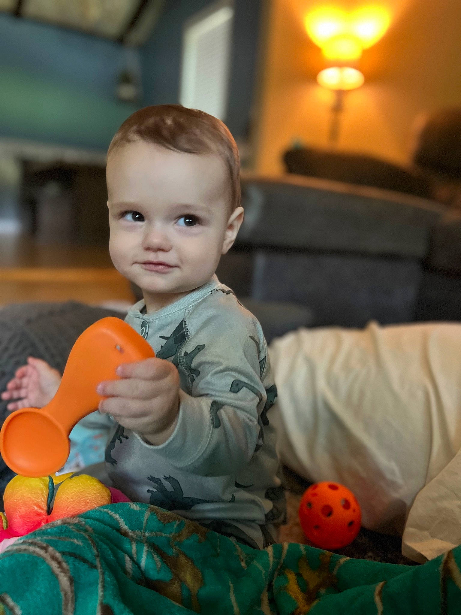 Alakai is registered to the contest to win money with this photo: baby, cheek, child, couch, eye, face, flooring, fun, happy, iris, leisure, orange, person, pumpkin, room, sitting, smile, toddler, toy, vegetable