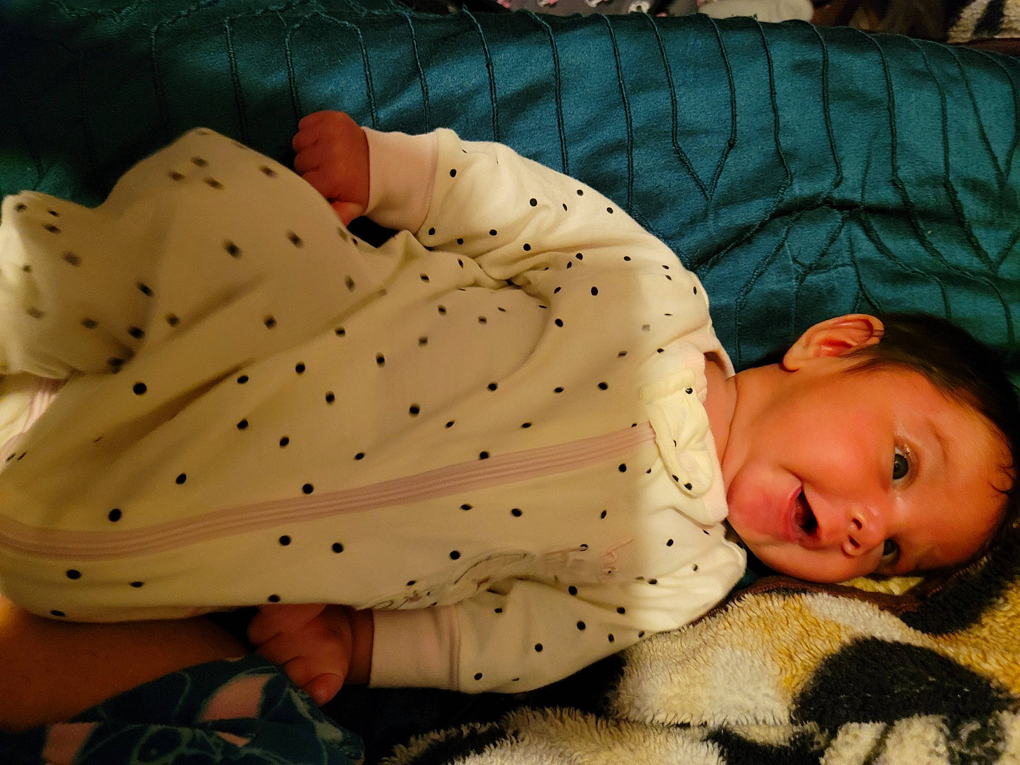 Melody is registered to the contest to win money with this photo: baby, baby_sleeping, baby_toddler_clothing, child, comfort, facial_expression, flooring, grass, head, headgear, human_leg, joint, linens, pattern, person, sitting, skin, sleeve, textile, toddler