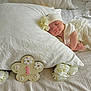 baby, newborn, infant, sleeping, pillow, white_bed, blanket, flower, headband, one_month_marker, milestone_sign, roses, bedroom, soft_lighting, portrait, cute, peaceful, hands, dress, props