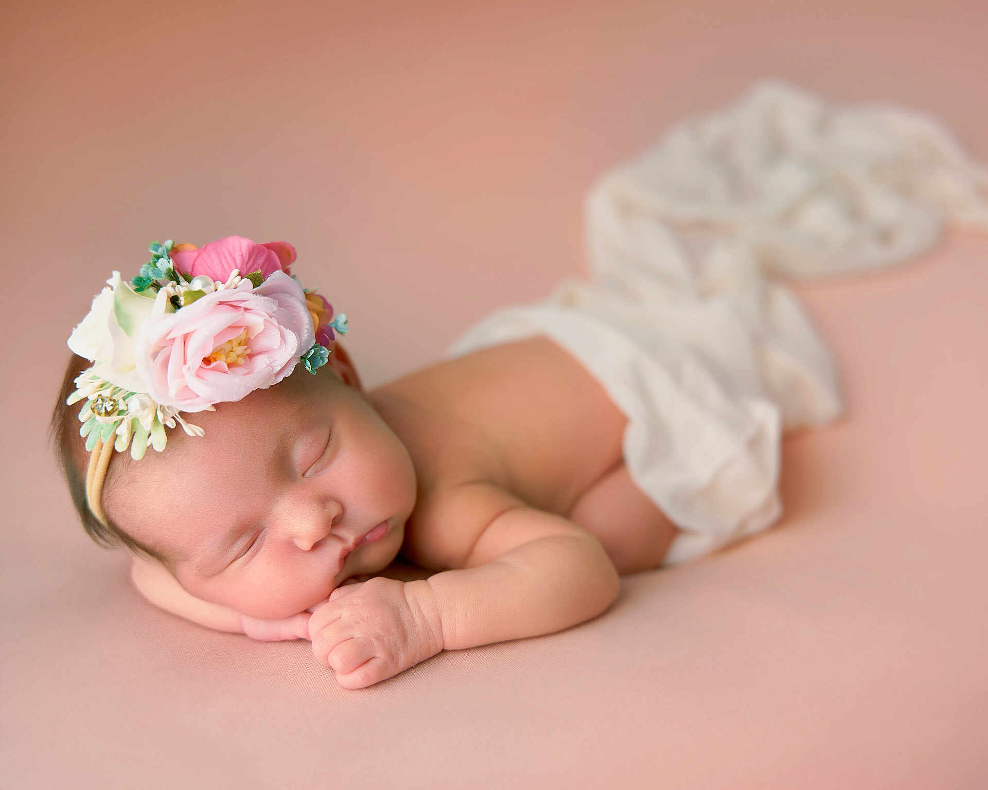 Zoë joined the competition — help win amazing prizes! baby, newborn, sleeping, flower_headband, pink_background, soft_texture, infant, peaceful, resting, cute, portrait, child, skin, hand, face, lying_down, white_cloth, closeup, adorable, tender