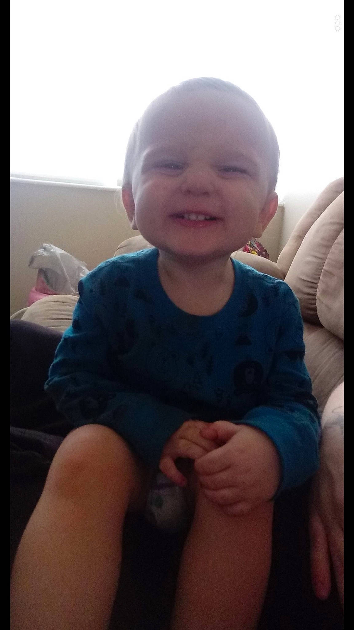 Braxton is registered to the contest to win money with this photo: baby, beauty, cheek, child, cool, eye, face, facial_expression, finger, fun, hand, head, leg, lip, mouth, nose, person, sitting, skin, smile