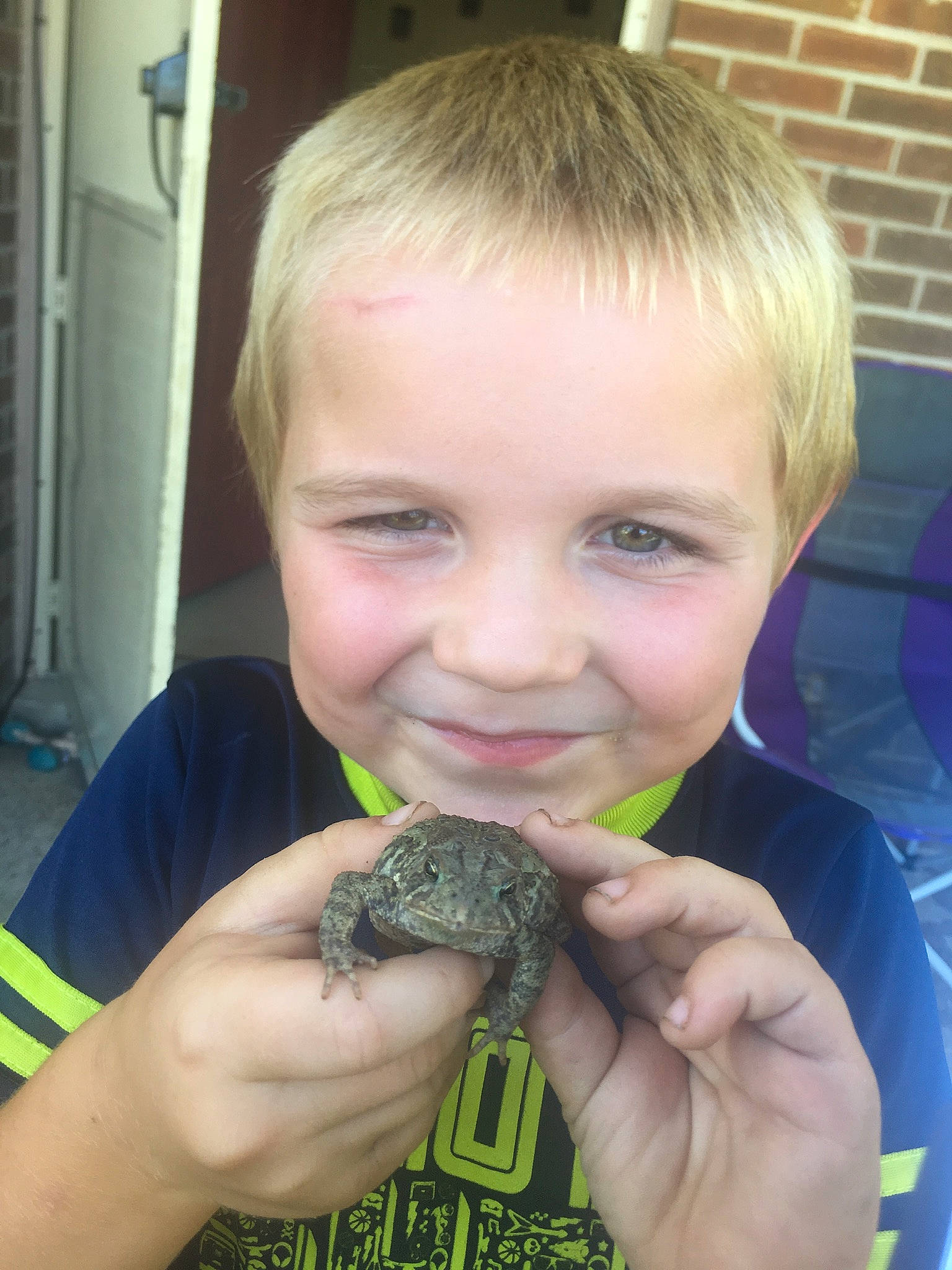 Axel is registered to the contest to win money with this photo: child, eating, joy, person, reptile