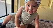 Azaelia-Ray is registered to the contest to win money with this photo: baby, child, headband, romper, carpet, door, mesh_screen, indoor, crawling, shoes, happy, curious, person, infant, floor, yellow, window, sunlight, smile, cute