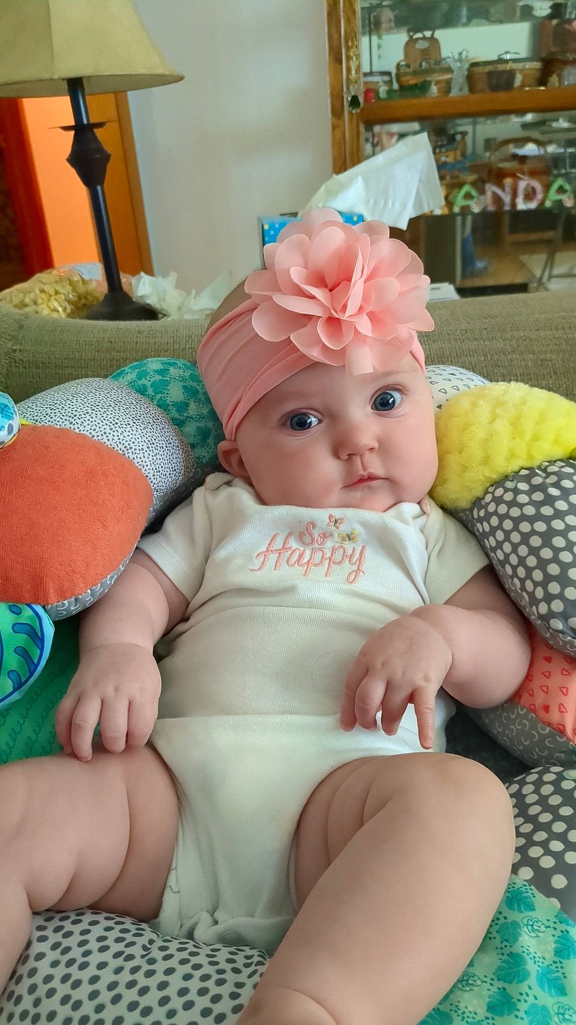 Bristol is registered to the contest to win money with this photo: baby, baby_products, baby_sleeping, baby_toddler_clothing, cheek, child, comfort, fashion_accessory, finger, foot, headgear, headwear, human_leg, jewellery, lap, person, pink, sitting, skin, textile