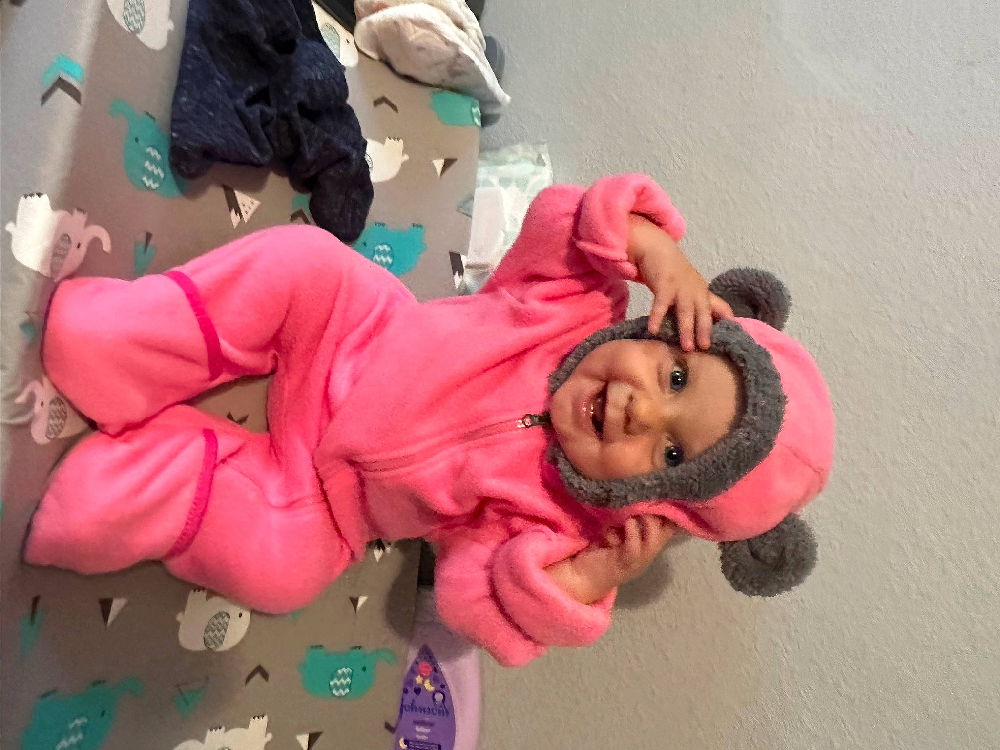 Athena is registered to the contest to win money with this photo: baby_toddler_clothing, child, costume, event, fun, happy, hat, headwear, joy, leisure, magenta, person, pink, plant, play, room, sitting, skin, smile, textile