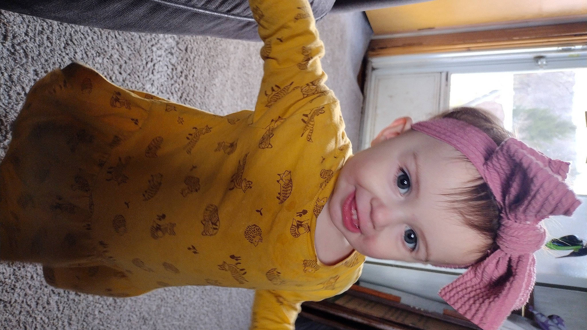 Frances joined the competition — help win amazing prizes! baby, baby_toddler_clothing, cheek, child, eye, face, facial_expression, happy, head, headgear, human_body, human_leg, joy, nose, pattern, person, sitting, skin, sleeve, smile