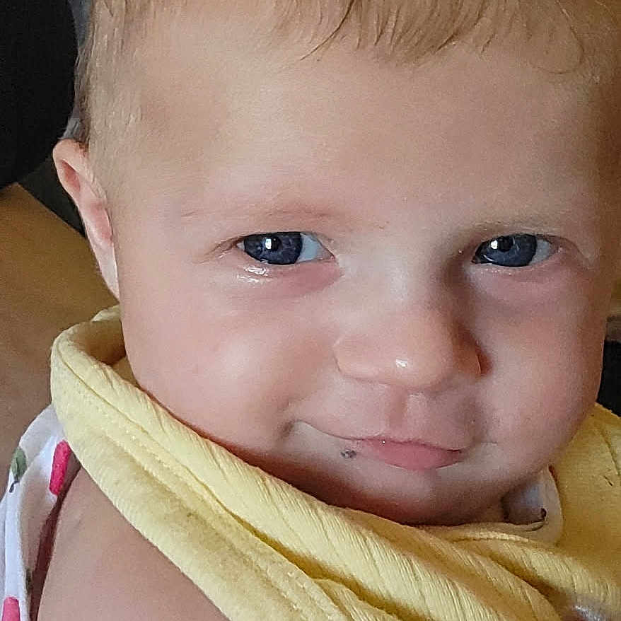 Lunella joined the competition — help win amazing prizes! baby, blue_eyes, cheek, child, close_up, clothing, cute, expression, eyelashes, face, hair, head, indoors, infant, person, portrait, skin, smile, yellow_cloth, young_child