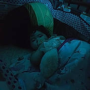 Raelynnda joined the competition — help win amazing prizes! baby, baby_clothing, bassinet, blanket, blue_light, calm, cozy, crib, dim_lighting, face, indoor, infant, lying_down, nighttime, nursery, pacifier, patterned_fabric, photography, portrait, sleeping