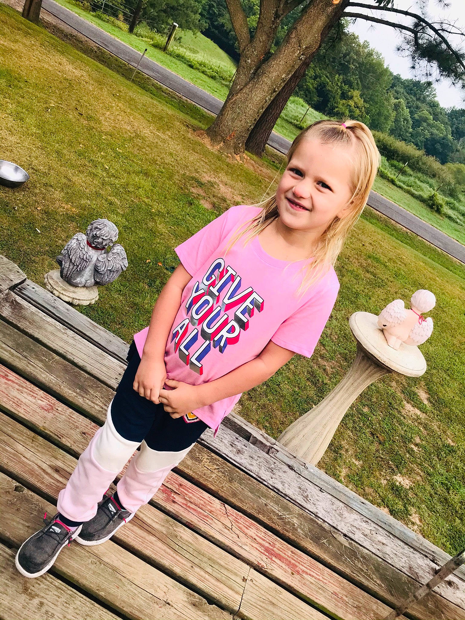 Chloe joined the competition — help win amazing prizes! fashion, flash_photography, grass, green, hairstyle, happy, joy, knee, leg, leisure, people_in_nature, person, pink, plant, shoe, shoulder, smile, street_fashion, thigh, tree