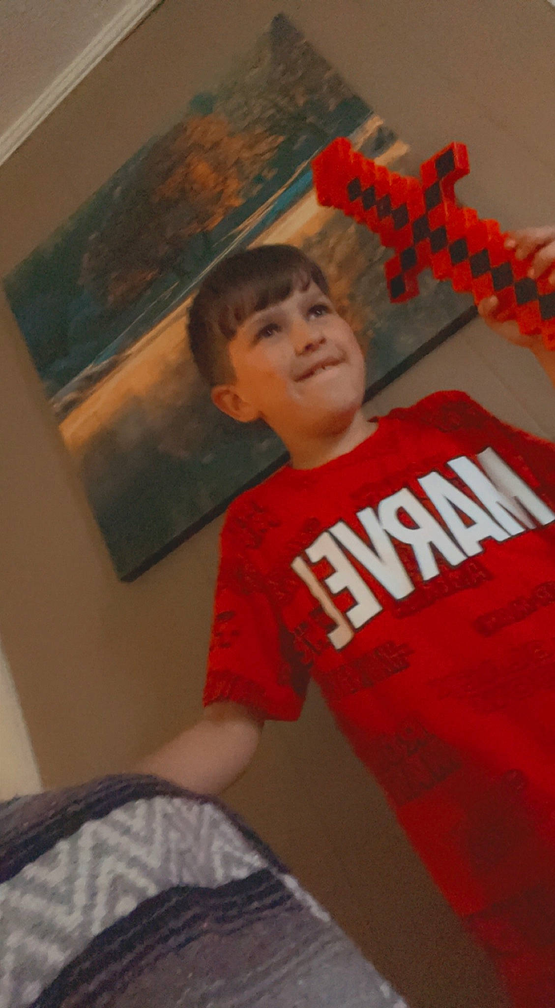 Aiden is registered to the contest to win money with this photo: active_shirt, art, cheek, chin, comfort, cool, elbow, facial_expression, font, forehead, fun, hairstyle, happy, joy, mouth, paint, person, room, shoulder, sleeve