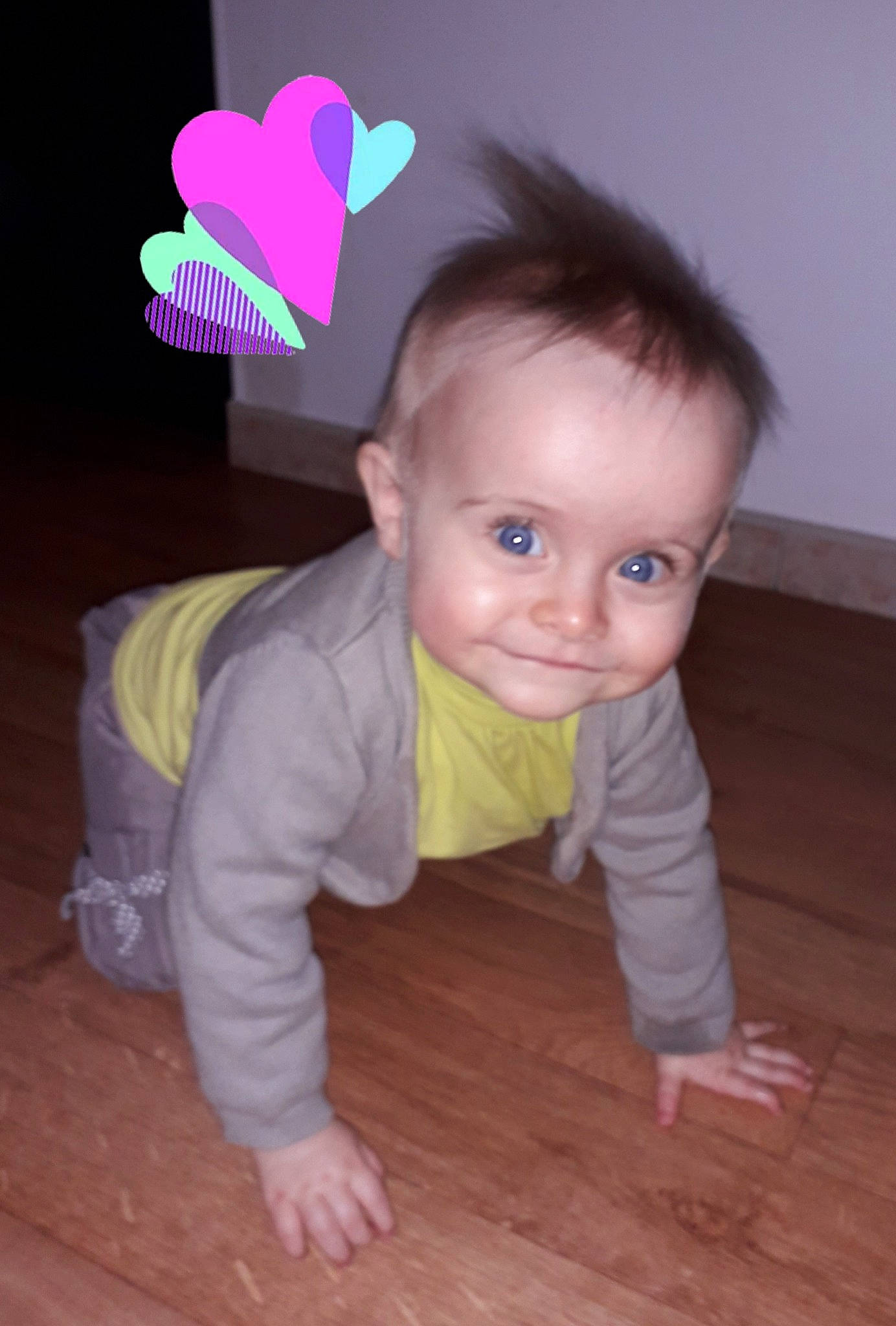 Lana participe au concours pour gagner de l'argent avec cette photo : baby, cheek, child, crawling, ear, eye, floor, flooring, fun, head, person, pink, play, skin, smile, toddler, wood