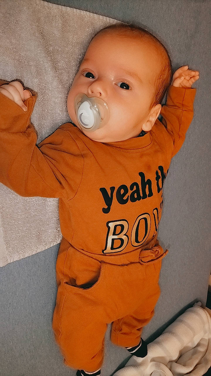 Noah joined the competition — help win amazing prizes! arm, baby, baby_products, baby_toddler_clothing, cheek, child, chin, comfort, eye, gesture, happy, hood, long_sleeved_t_shirt, mouth, nose, orange, outerwear, person, sleeve, t_shirt