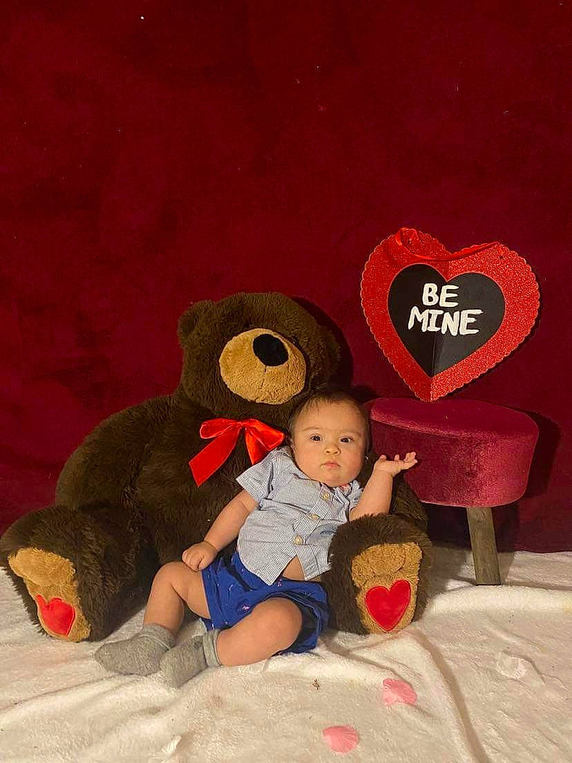 Valentin joined the competition — help win amazing prizes! art, baby, baby_toddler_clothing, carmine, child, comfort, fictional_character, happy, holiday, illustration, leg, person, plush, red, room, sitting, stuffed_toy, teddy_bear, toddler, toy