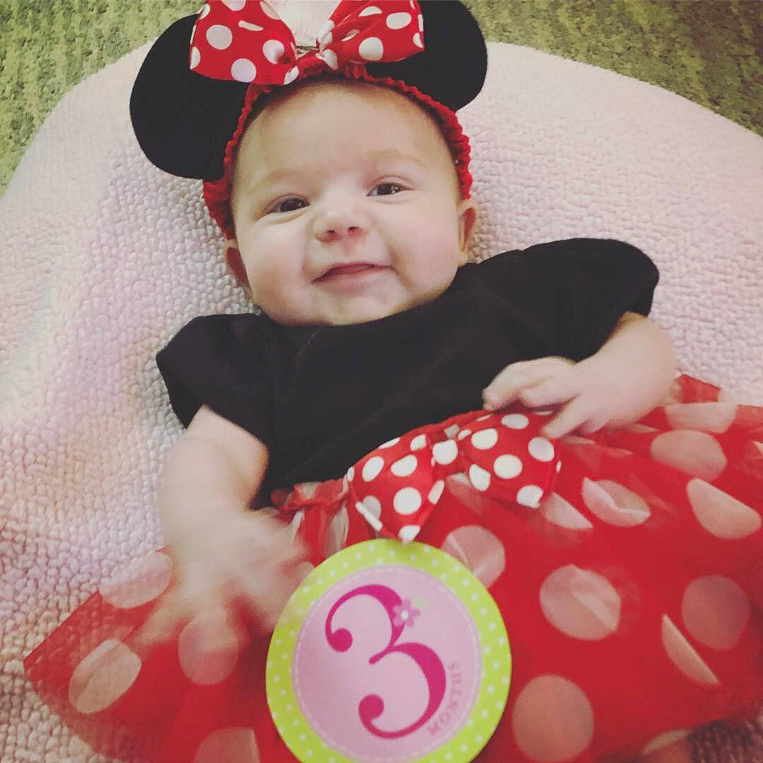 Siena is registered to the contest to win money with this photo: baby_products, cheek, child, day, design, hair_accessory, headgear, infant, material, pattern, person, pink, play, polka_dot, product, red, skin, smile, stuffed_toy, textile