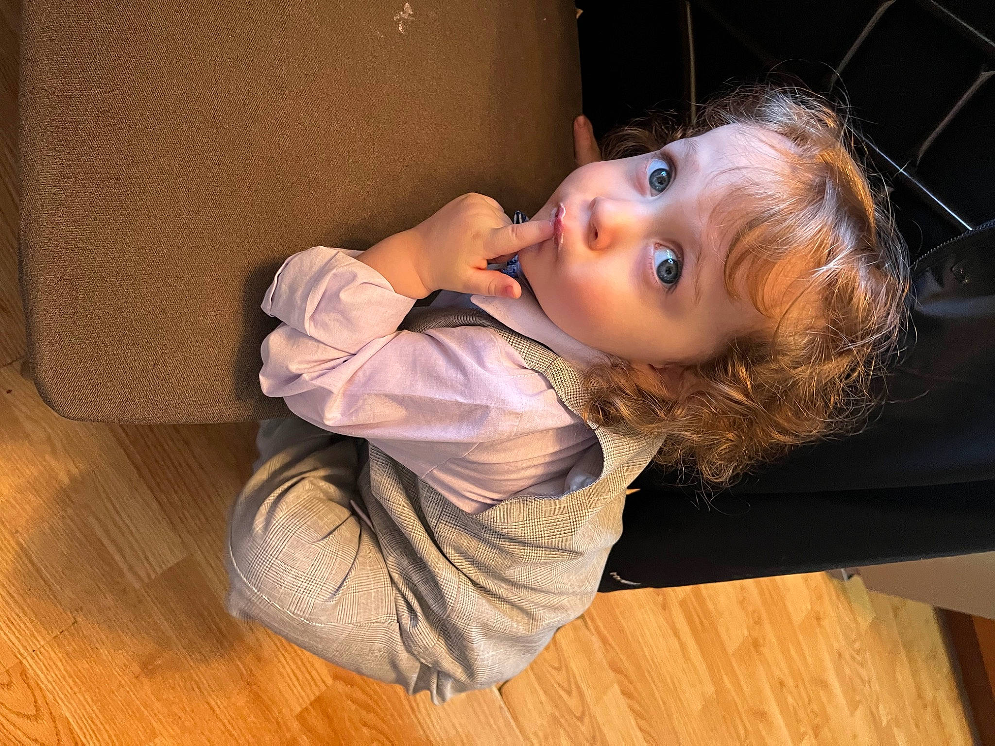 Joel Jr is registered to the contest to win money with this photo: arm, brown_hair, comfort, elbow, eyelash, flash_photography, floor, flooring, fun, hardwood, laminate_flooring, neck, nose, person, room, sitting, toddler, varnish, wood, wood_flooring