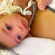 Halaysian joined the competition — help win amazing prizes! baby, infant, face, skin, blanket, hand, fist, closeup, lying_down, soft_texture, curious, indoor, person, child, cute, newborn, expression, comfort, warmth, toddler