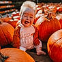 baby, child, pumpkin, orange, autumn, fall, cute, smiling, tongue_out, hair, shirt, outdoor, holiday, seasonal, nature, happy, sitting, festive, fun, portrait