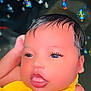 Lydia is registered to the contest to win money with this photo: baby, infant, close_up, face, yellow_clothing, sleepy, long_eyelashes, cute, child, portrait, indoors, colorful_lights, bokeh, soft_skin, head, expression, young, human, adorable, peaceful