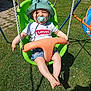 toddler, child, swing, green_swing, pacifier, hat, sunhat, shorts, white_tshirt, levi's, outdoor, grass, playground, summer, daylight, shadow, happy, smiling, barefoot, baby