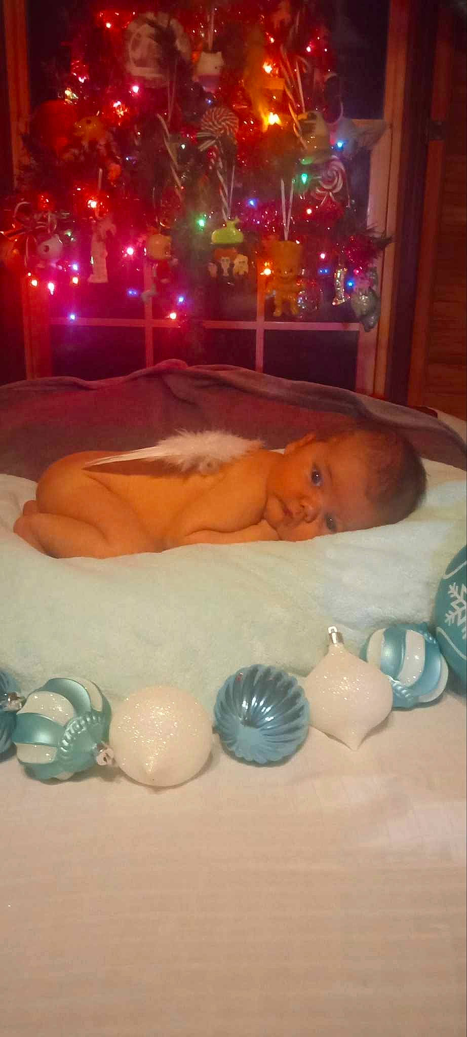 Kingston is registered to the contest to win money with this photo: baby, baby_products, baby_toys, child, event, flooring, fun, glass, holiday, light, lighting, person, plastic, play, porcelain, room, serveware, still_life_photography, toddler, toy