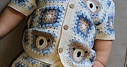 Luka is registered to the contest to win money with this photo: baby, child, sunglasses, crochet, clothing, bear_pattern, shorts, shirt, couch, furniture, indoor, portrait, cute, fashion, knitwear, relaxing, person, hand, face, eyewear