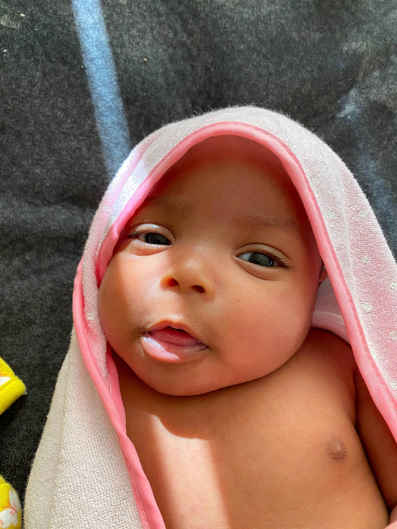 Layaníí is registered to the contest to win money with this photo: baby, beauty, cheek, child, close_up, eye, face, head, headgear, headwear, linens, lip, mouth, nose, person, pink, skin, smile, toddler, towel