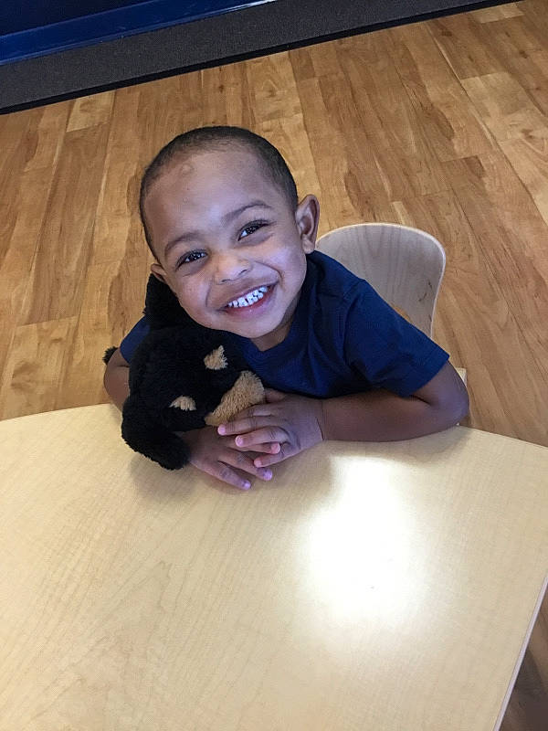 Elyas joined the competition — help win amazing prizes! arm, baby, child, face, facial_expression, floor, flooring, fun, happy, hardwood, head, joy, laugh, person, play, sitting, smile, toddler, vacation, wood