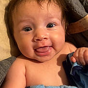 Nezuko is registered to the contest to win money with this photo: baby, babylaughing, blanket, bodypart, clothing, couch, face, finger, furniture, hand, happy, head, laughing, mouth, newborn, pants, person, photography, portrait, quilt