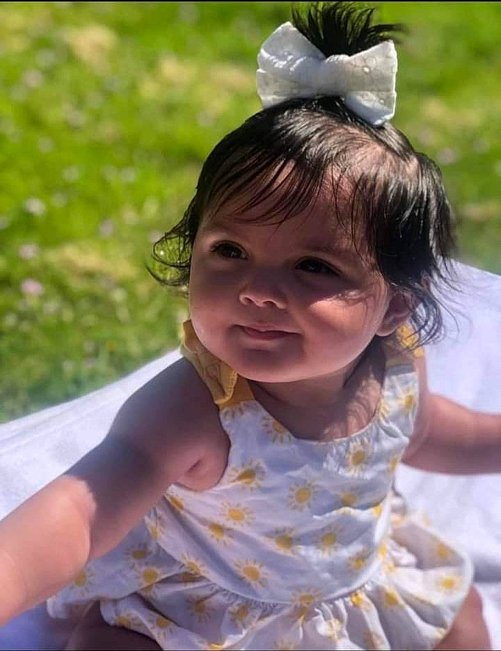 Hazel is registered to the contest to win money with this photo: baby_toddler_clothing, child, face, fashion_accessory, fun, grass, hairstyle, happy, head, headpiece, jewellery, leaf, leisure, people_in_nature, person, pink, recreation, skin, smile, summer