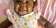 Kalenci joined the competition — help win amazing prizes! baby, smiling, yellow_bow, floral_outfit, ruffles, pink_blanket, clouds, sun, rainbow, infant, cute, happy, lying_down, headband, cheerful, child, person, toddler, patterned_clothing, indoors