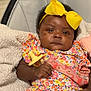 Kalenci is registered to the contest to win money with this photo: baby, child, infant, yellow_bow, pacifier, floral_clothing, blanket, seated, cute, headband, indoors, portrait, adorable, soft_texture, comfort, young_child, colorful, infant_girl, baby_clothes, relaxed