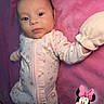 Cecilia is registered to the contest to win money with this photo: baby, infant, pink_blanket, onesie, mittens, lying_down, cute, soft_texture, cartoon_sticker, minnie_mouse, child, portrait, indoors, baby_clothes, sleepwear, adorable, face, young_child, baby_girl, resting