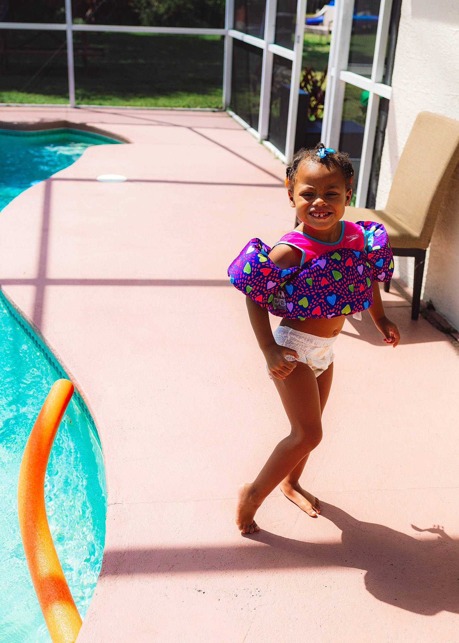 Legacy is registered to the contest to win money with this photo: barefoot, child, electric_blue, foot, fun, happy, human_leg, joy, leg, leisure, magenta, person, play, recreation, shade, street, thigh, tints_and_shades, toddler, vacation