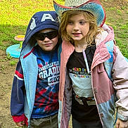 Gracelyn is registered to the contest to win money with this photo: casual_clothing, child, children, cowboy_hat, friendship, fun, grass, hat, hoodie, jacket, jeans, marker, nature, outdoor, person, playground, smile, sunglasses, toy, yard