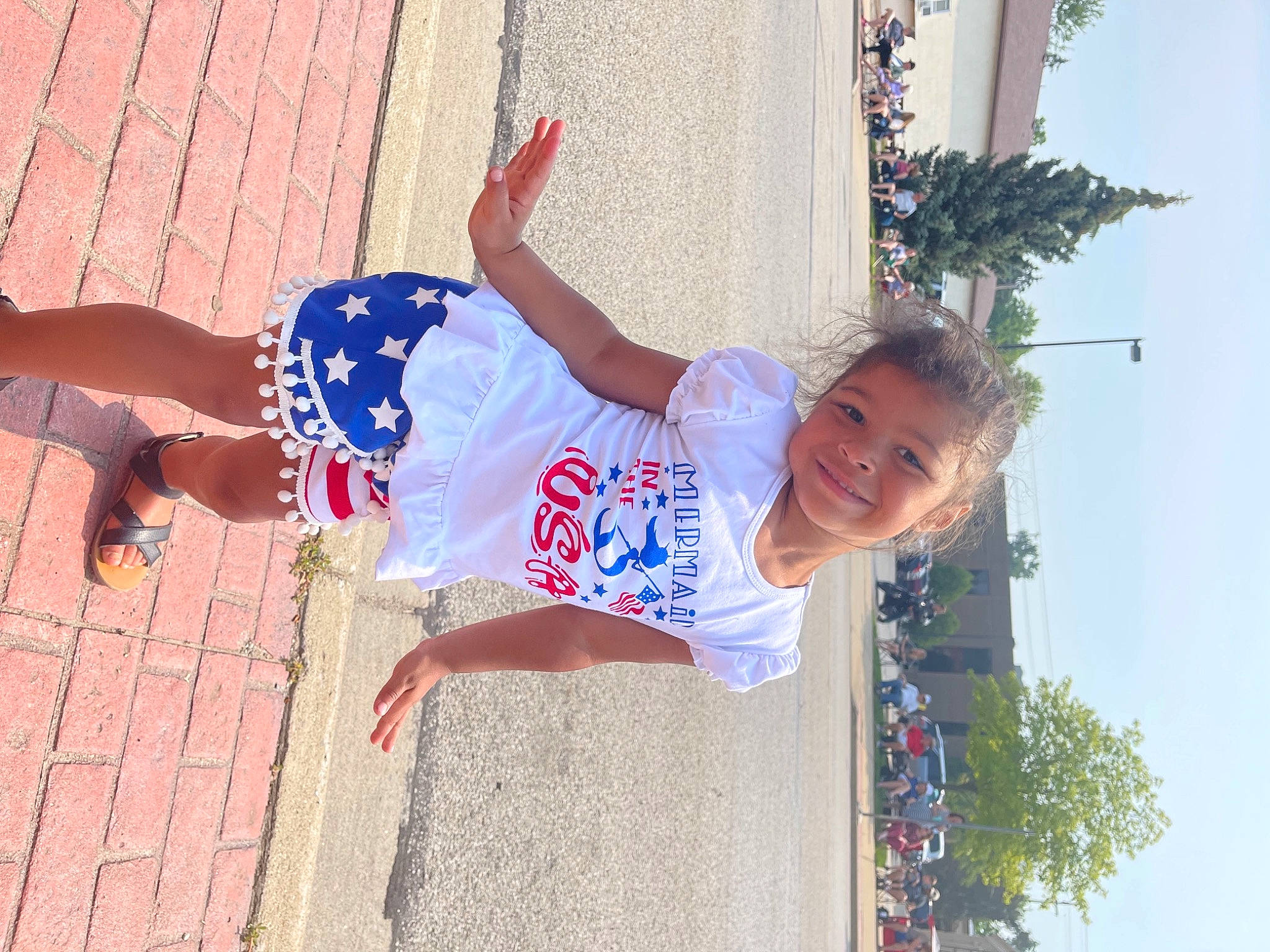 Juliahna is registered to the contest to win money with this photo: child, entertainment, fun, happy, human_leg, joy, leisure, palm_tree, performing_arts, person, public_event, recreation, shorts, sky, smile, street_fashion, t_shirt, thigh, tree, trunk